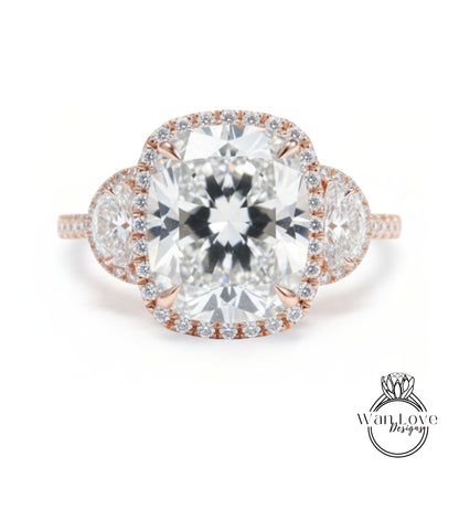 A large, round diamond engagement ring with a halo of smaller diamonds around the center stone.