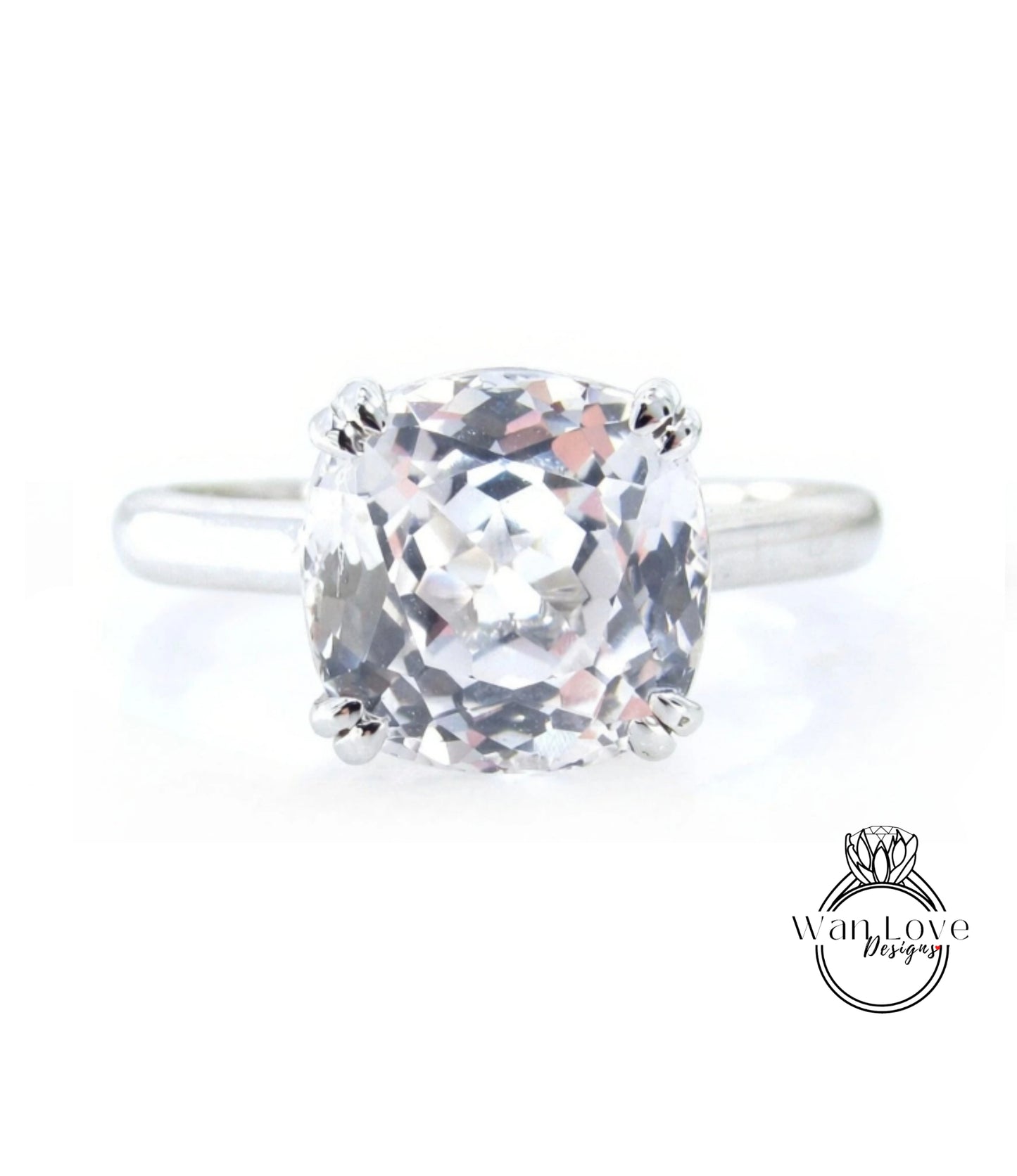 A close-up view of a diamond engagement ring with a large, clear gemstone set in a silver band.