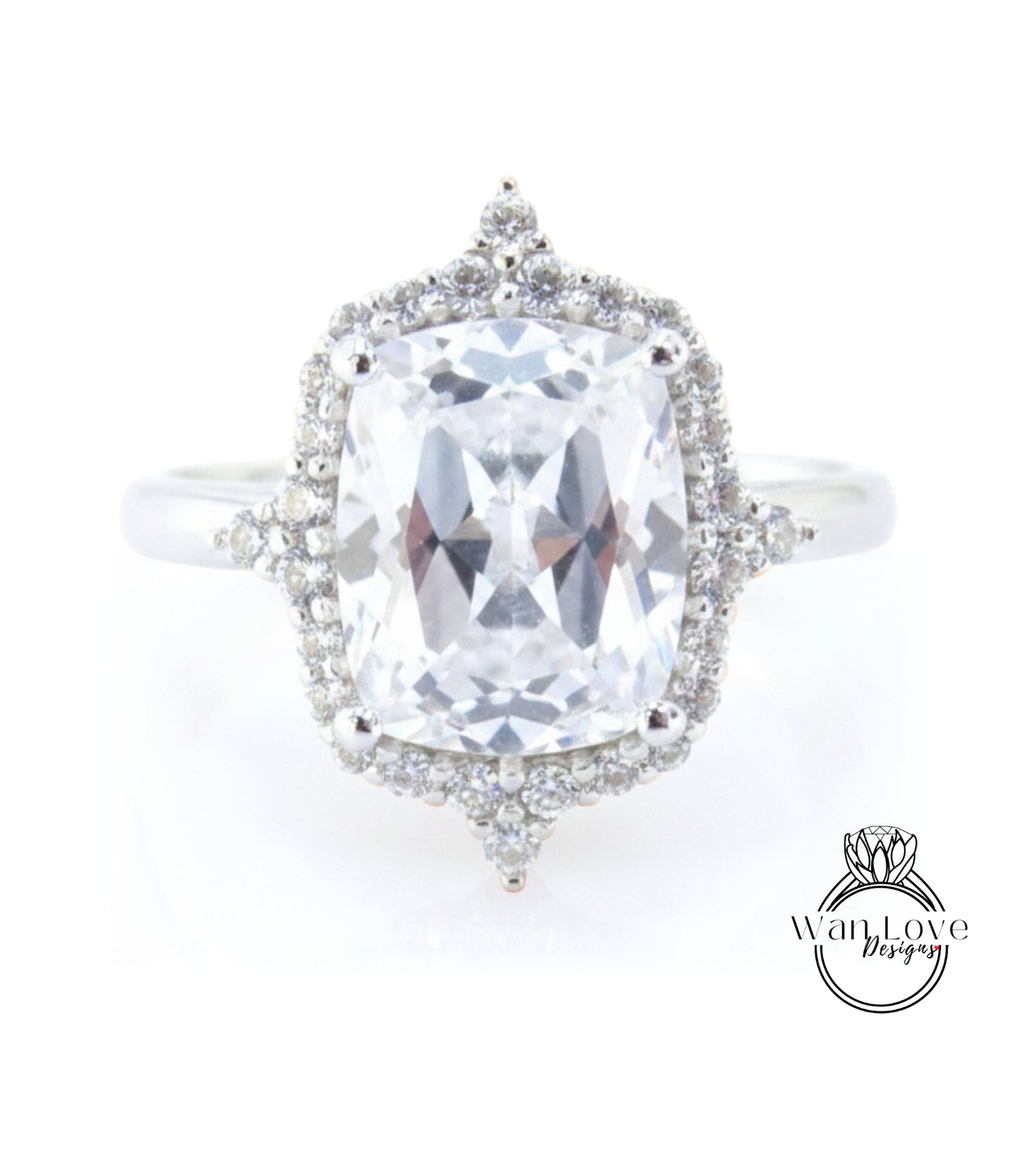 A large, clear gemstone ring with a halo of smaller diamonds around the center stone.