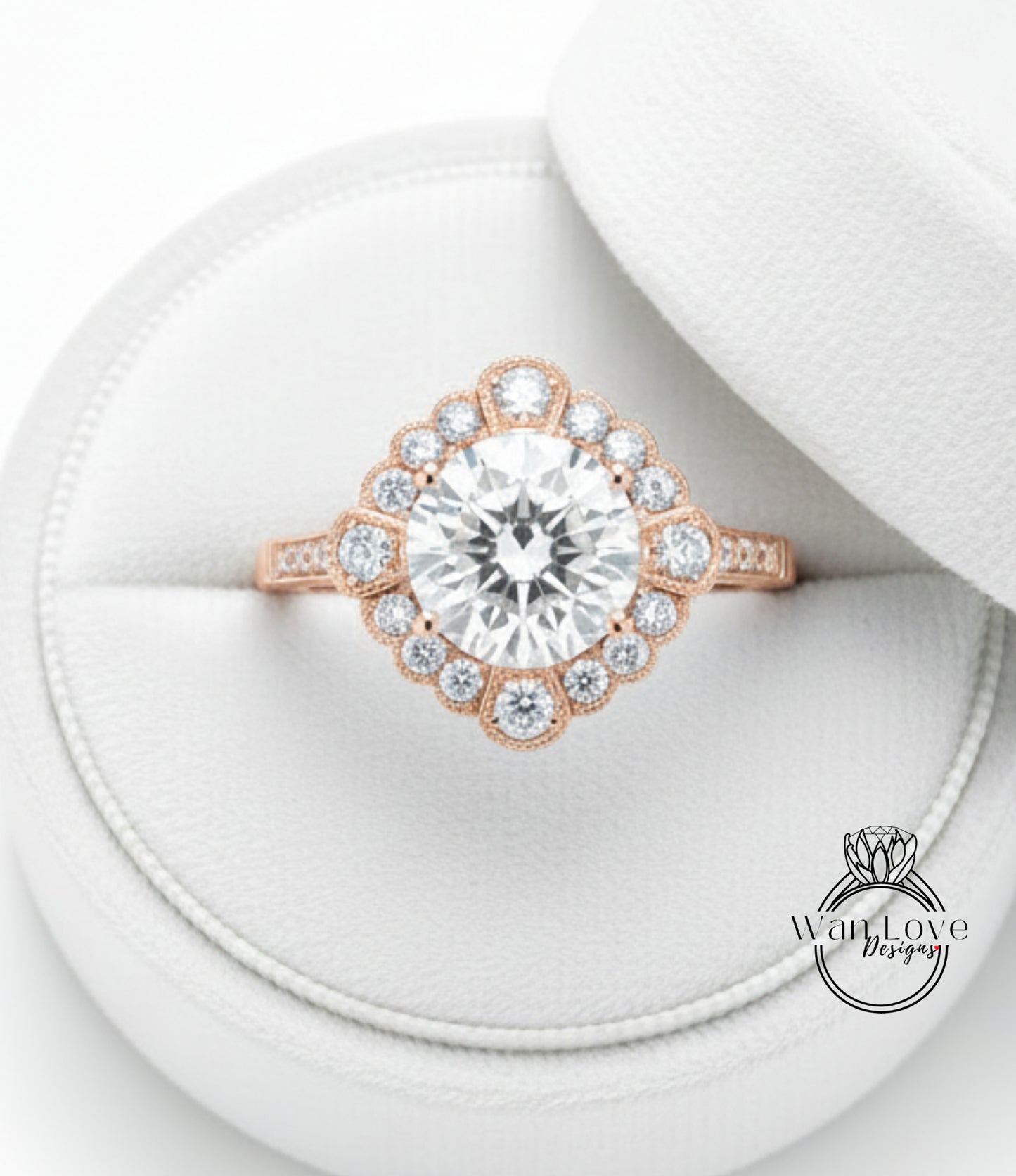 A large, sparkling diamond ring is displayed in a white jewelry box, showcasing its intricate design and sparkling gemstones.