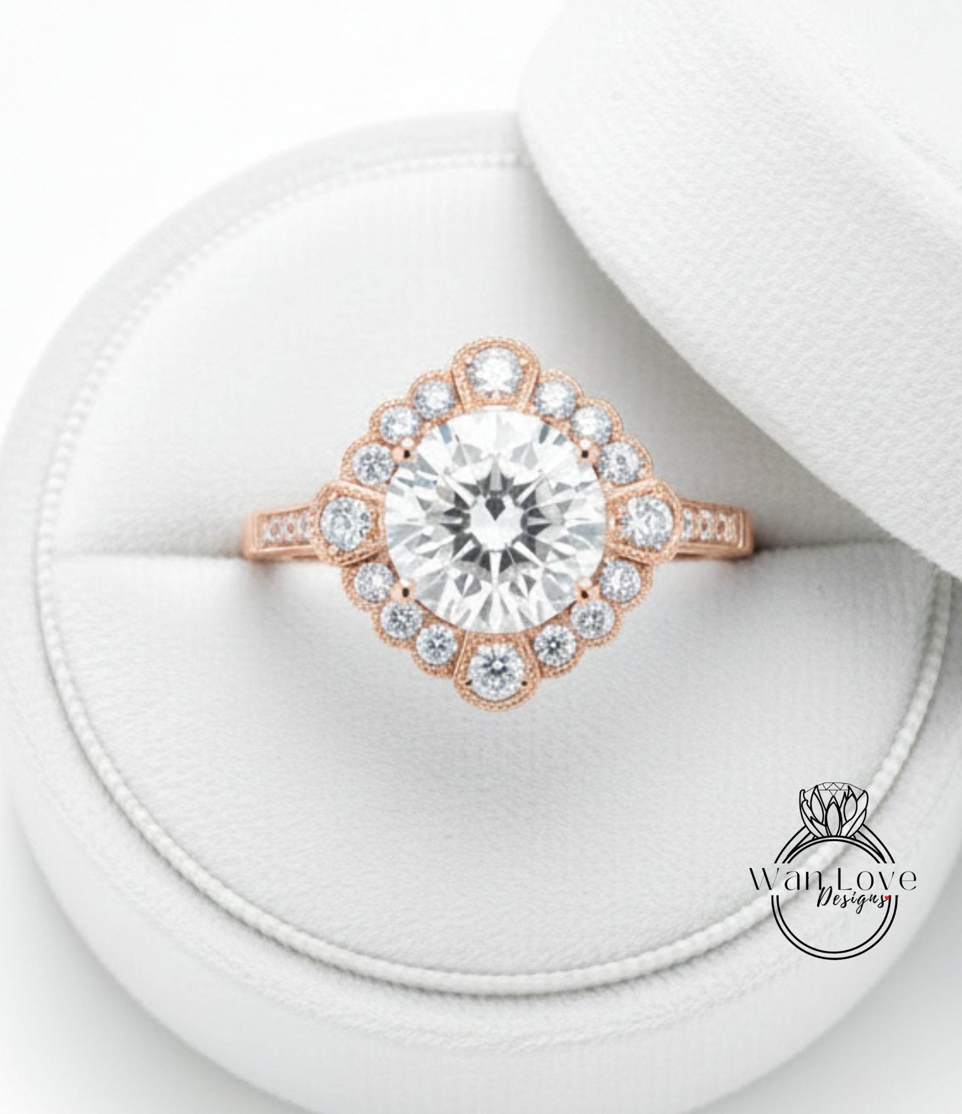 A large, sparkling diamond ring is displayed in a white jewelry box, showcasing its intricate design and sparkling gemstones.