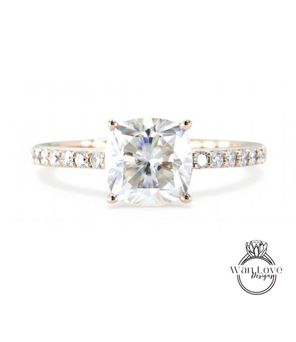 A diamond engagement ring with a large, brilliant-cut diamond set in a solitaire ring band.