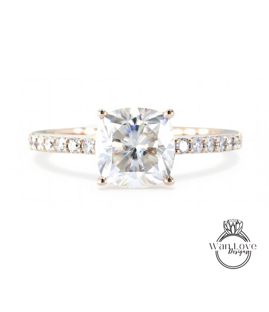 A diamond engagement ring with a large, brilliant-cut diamond set in a solitaire ring band.
