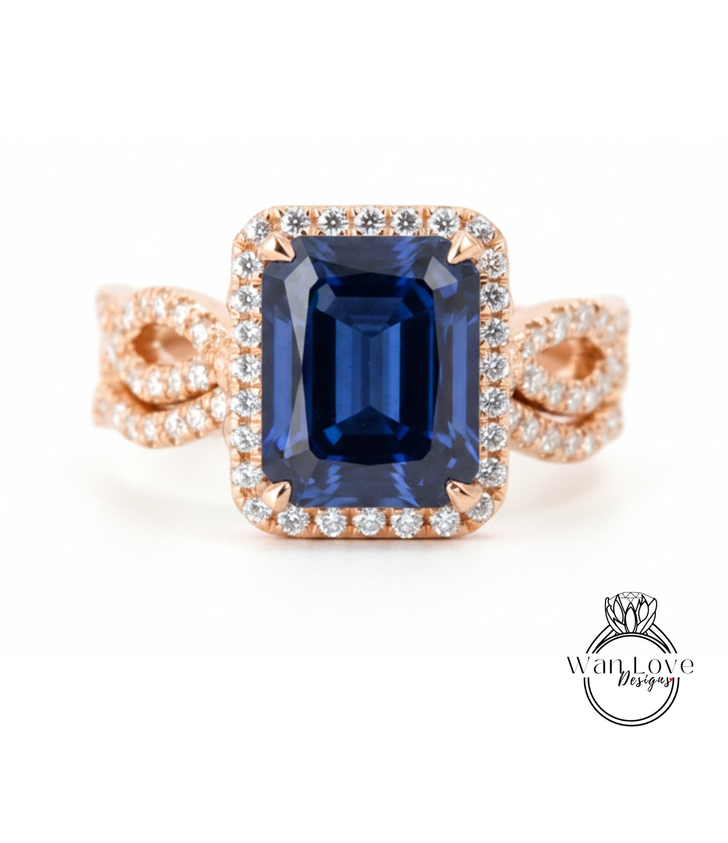 A large blue gemstone ring with a halo of smaller diamonds around the center stone.