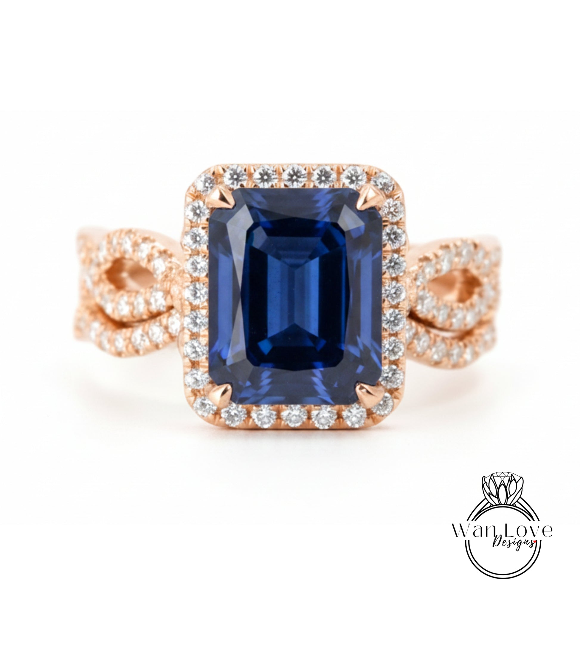 A large blue gemstone ring with a halo of smaller diamonds around the center stone.