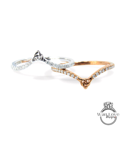 Two rings with a silver band and a gold band with a silver band, both adorned with small diamonds.