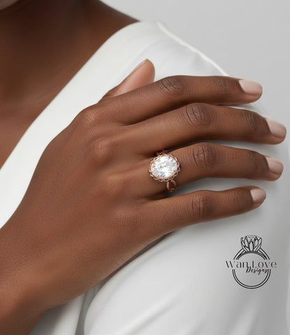A close-up of a person's hand wearing a large, ornate ring with a large central stone.