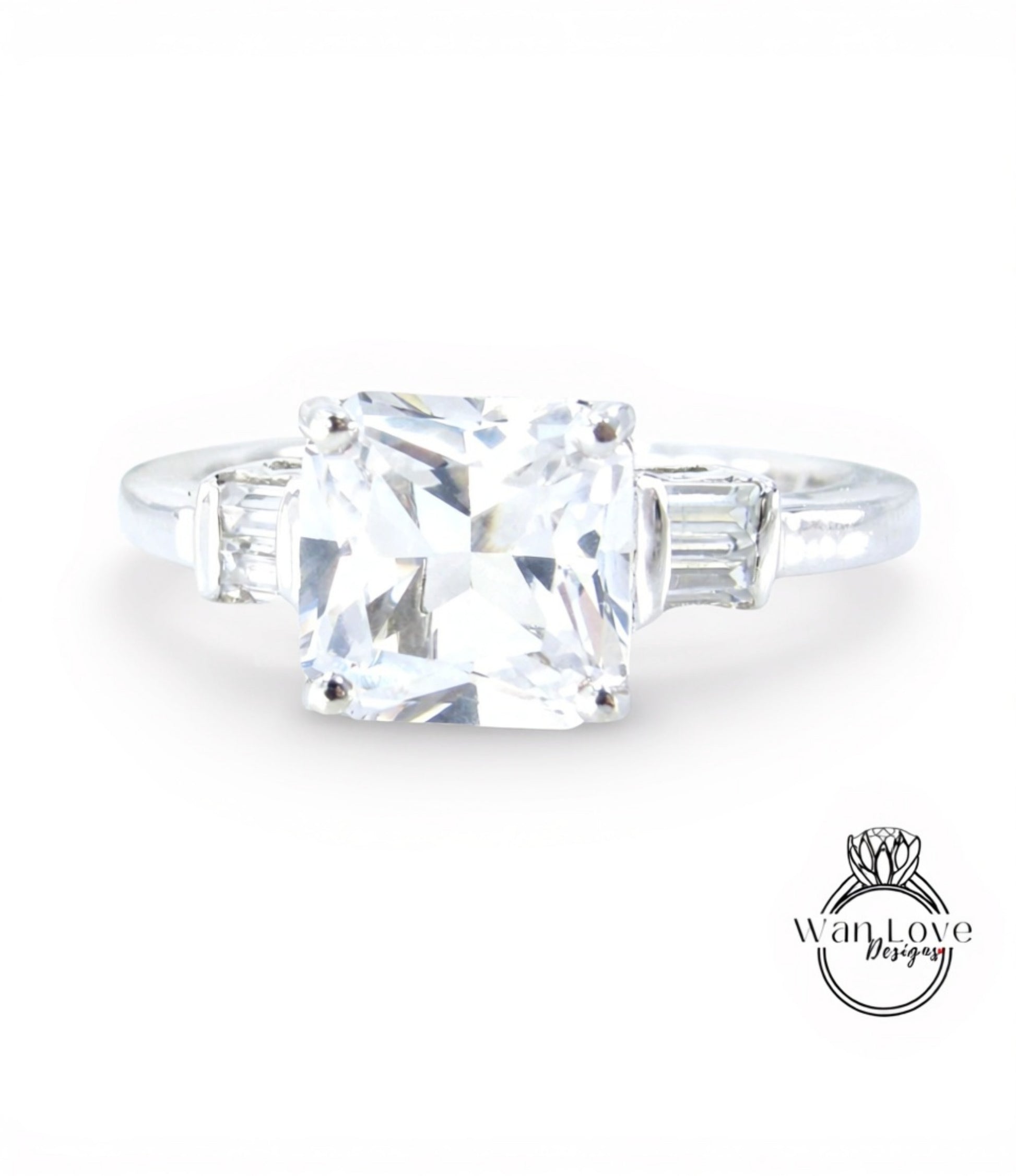 A diamond engagement ring with a large, clear gemstone set in a silver band.