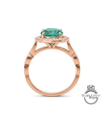 A rose gold ring with a large, round, green gemstone set in the center.