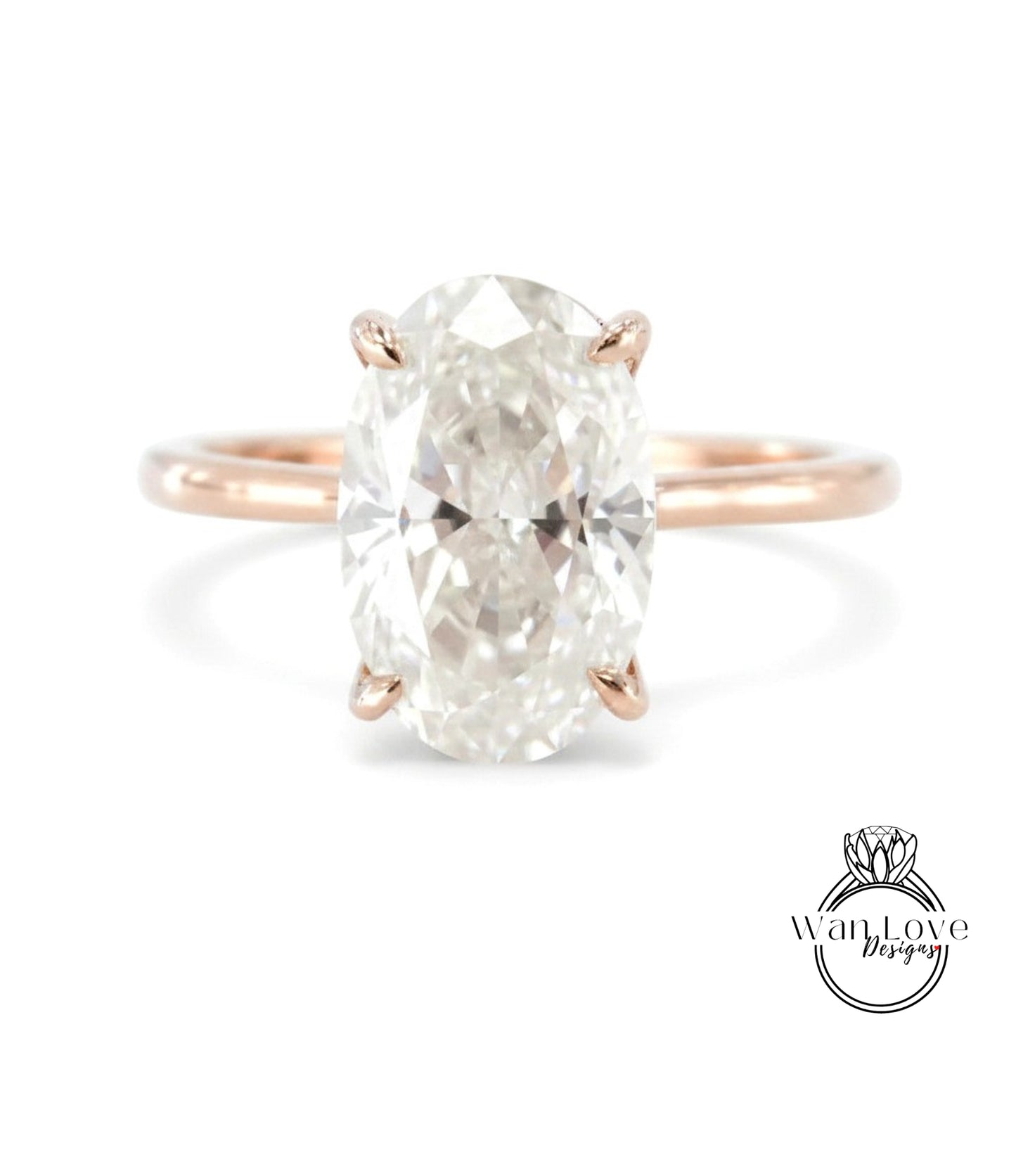 A large oval-shaped diamond engagement ring with a rose gold band.
