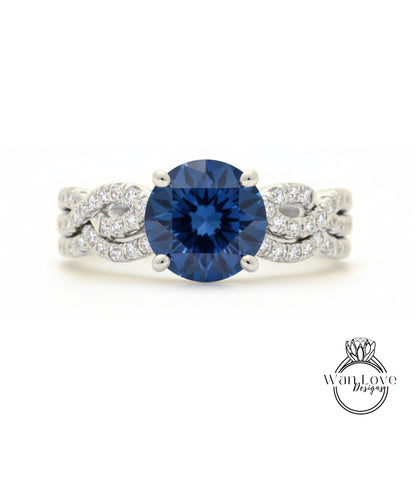 A stunning blue diamond engagement ring with a large central diamond surrounded by smaller diamonds set in a silver band.