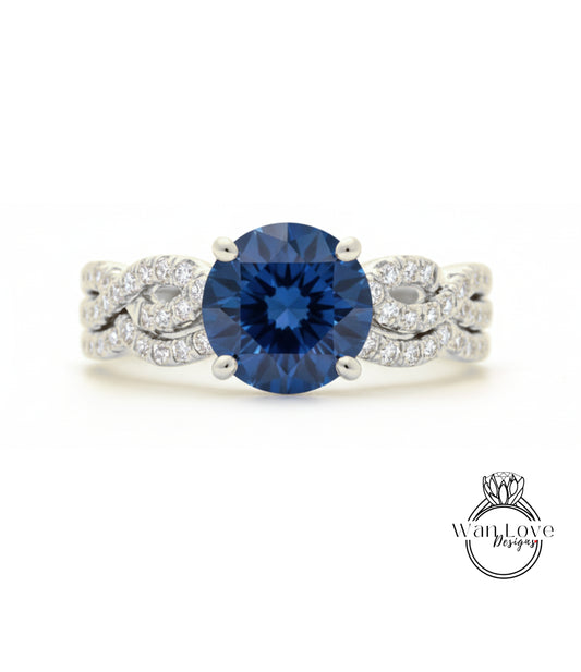 A stunning blue diamond engagement ring with a large central diamond surrounded by smaller diamonds set in a silver band.