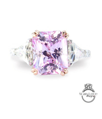A large, pink gemstone ring with a diamond-encrusted band.
