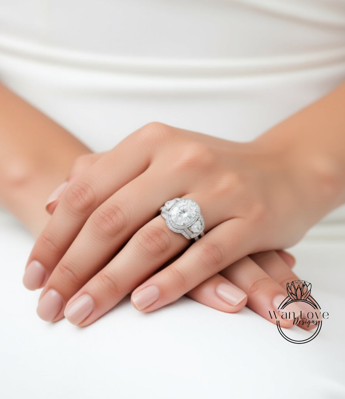 A close-up of a person's hands wearing a large, ornate diamond ring.