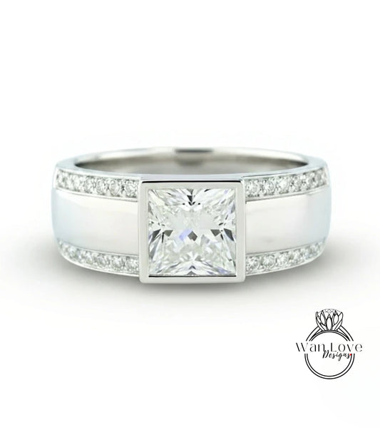 A silver ring with a large diamond in the center, surrounded by smaller diamonds along the band.