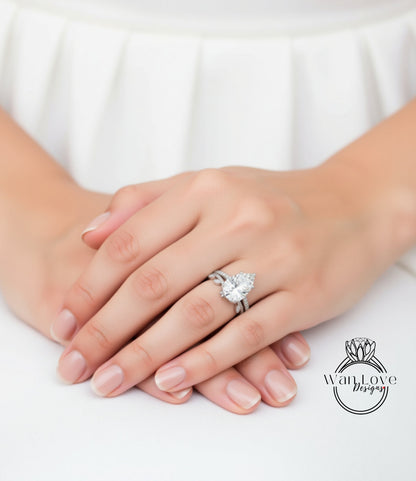 A close-up of a person's hands wearing a diamond engagement ring.