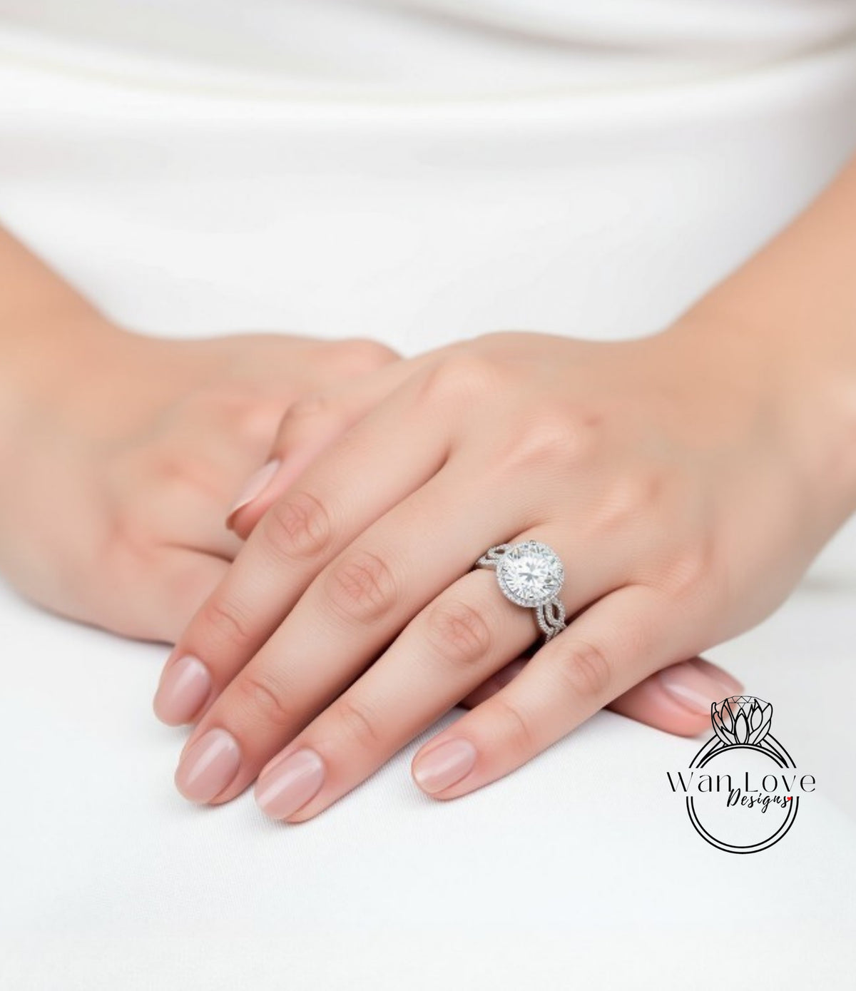 A close-up of a person's hand wearing a large diamond engagement ring.