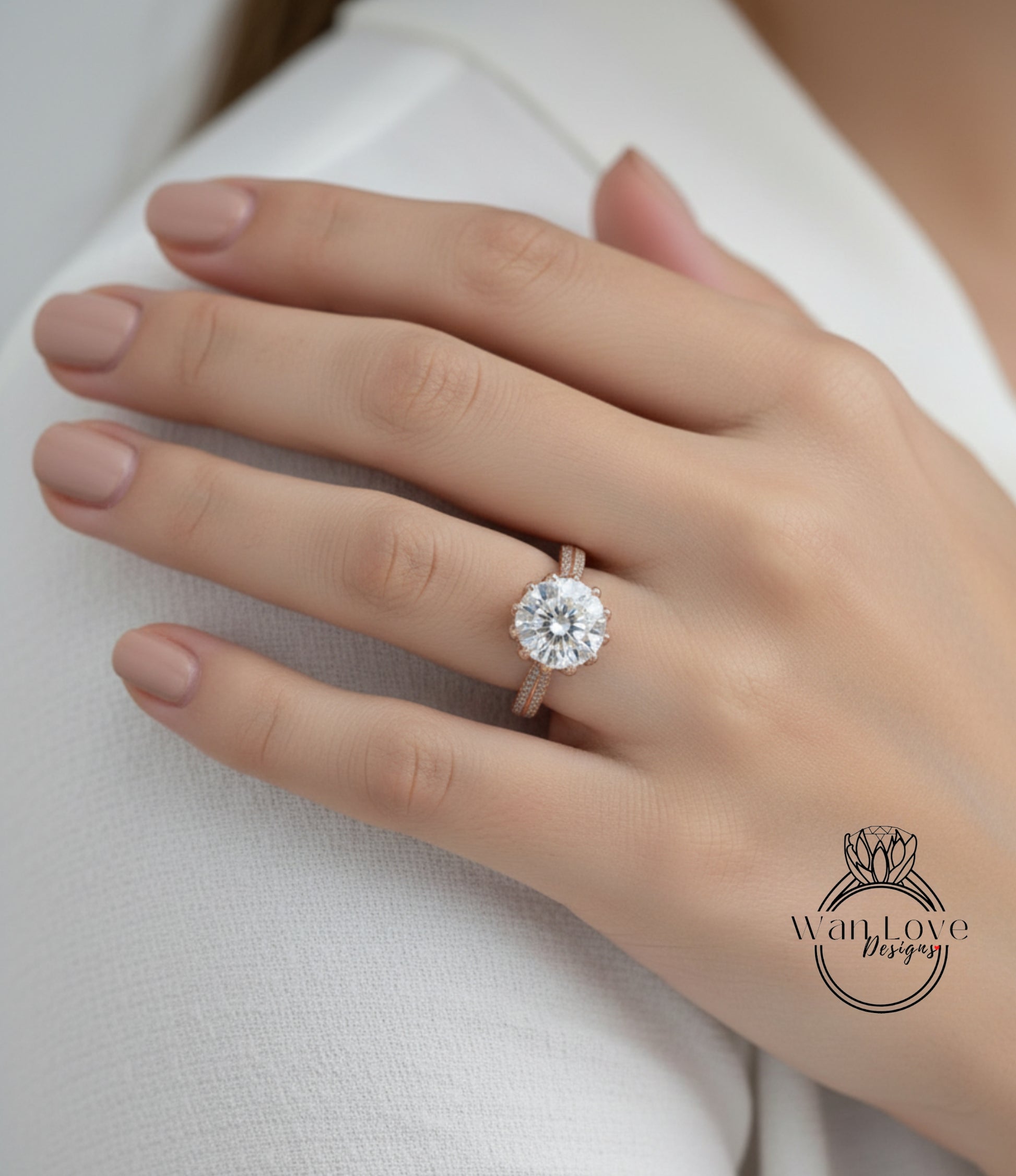 A close-up of a person's hand wearing a large, round diamond engagement ring.