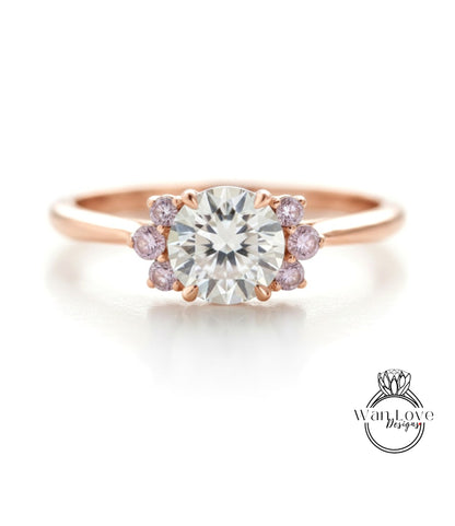 a beautiful engagement ring with a large central diamond surrounded by smaller diamonds on either side.