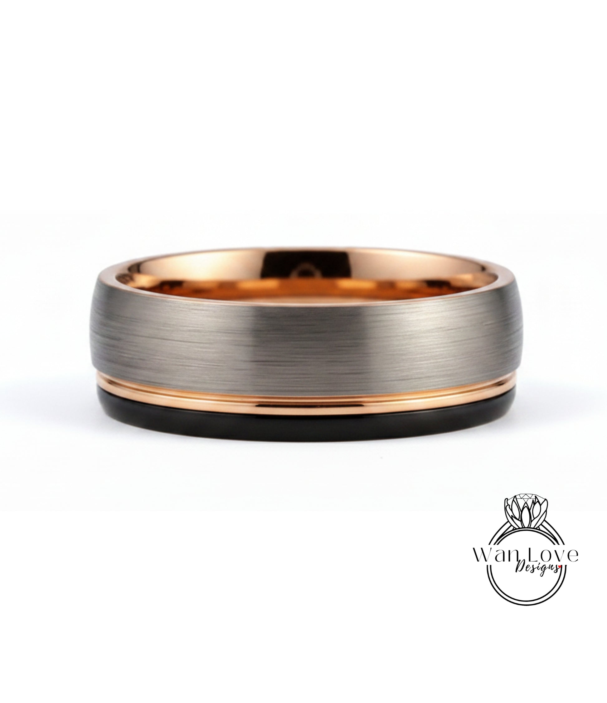 A silver-toned ring with a thin gold band and a black band, set against a white background.