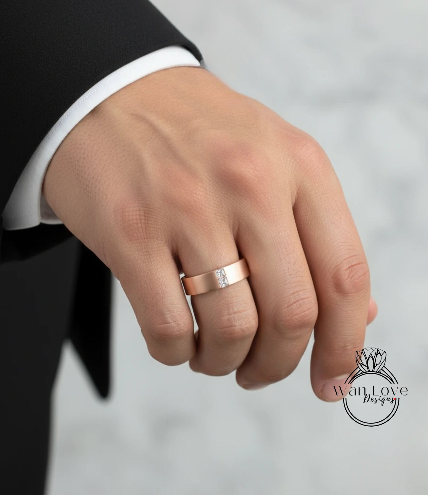 A close-up of a person's hand wearing a gold wedding ring.
