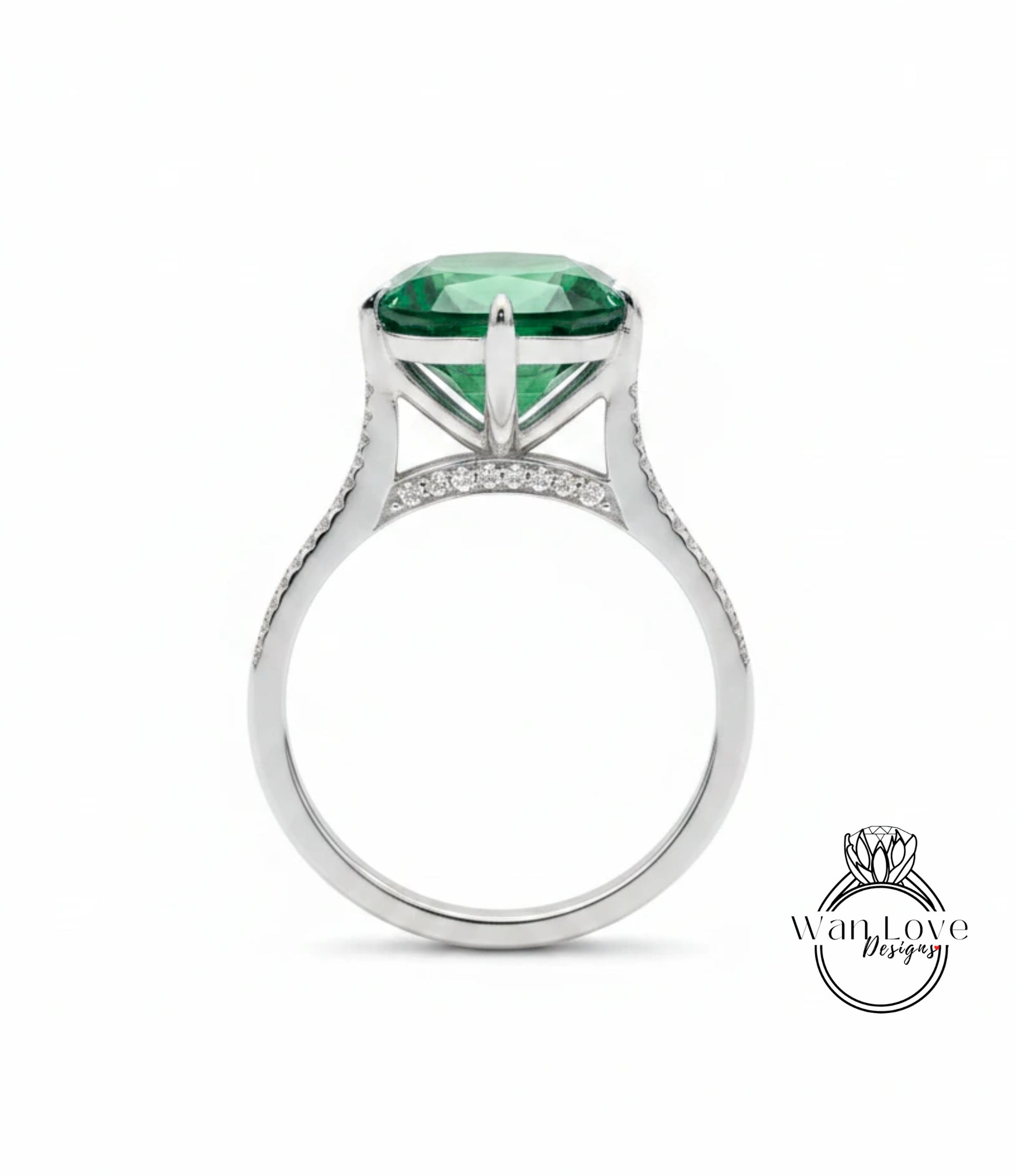 A silver ring with a large, green gemstone set in the center.