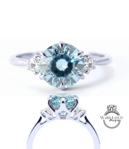 A close-up view of a silver ring with a large blue gemstone, showcasing the intricate design and craftsmanship of the piece.