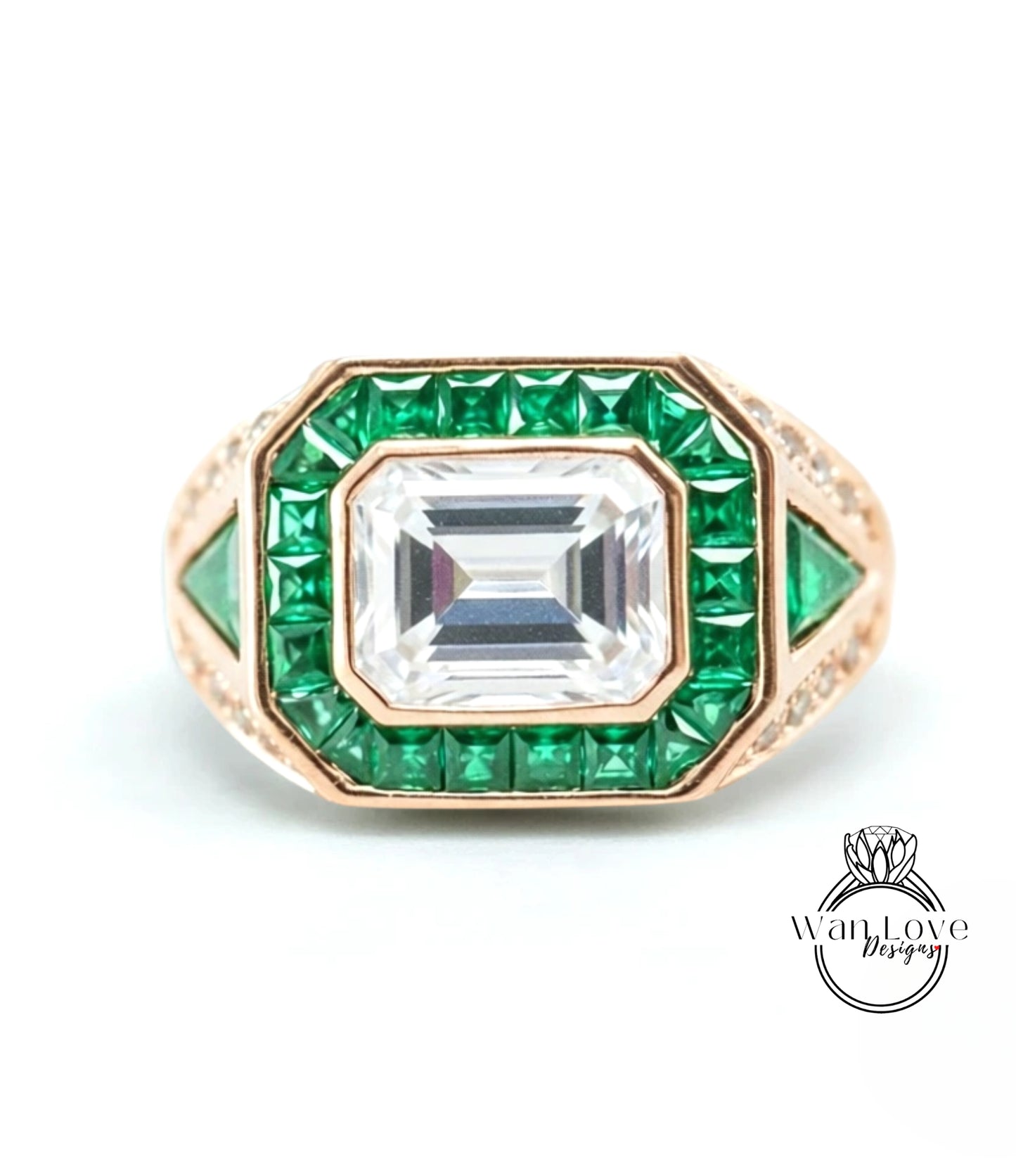 a ring with a large central gemstone surrounded by smaller green gemstones.