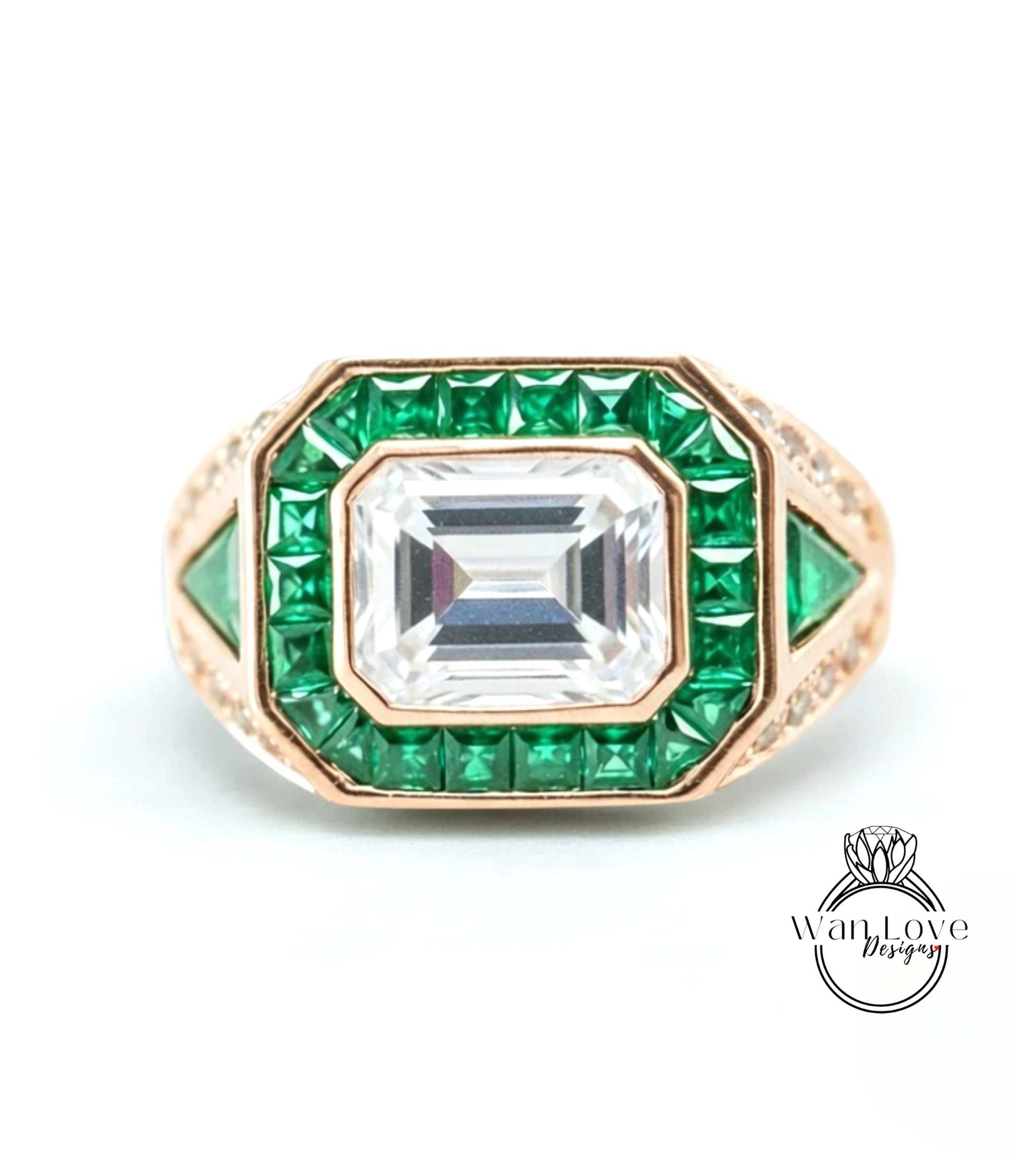 a ring with a large central gemstone surrounded by smaller green gemstones.