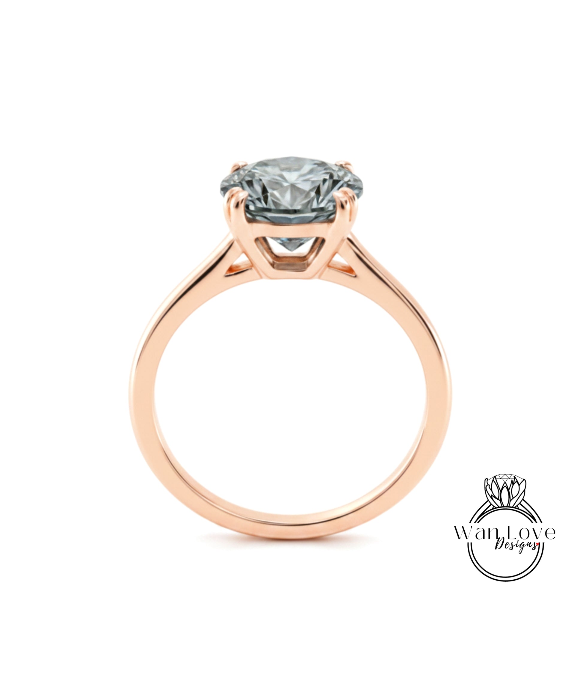 A rose gold engagement ring with a large, clear gemstone set in the center of the band.