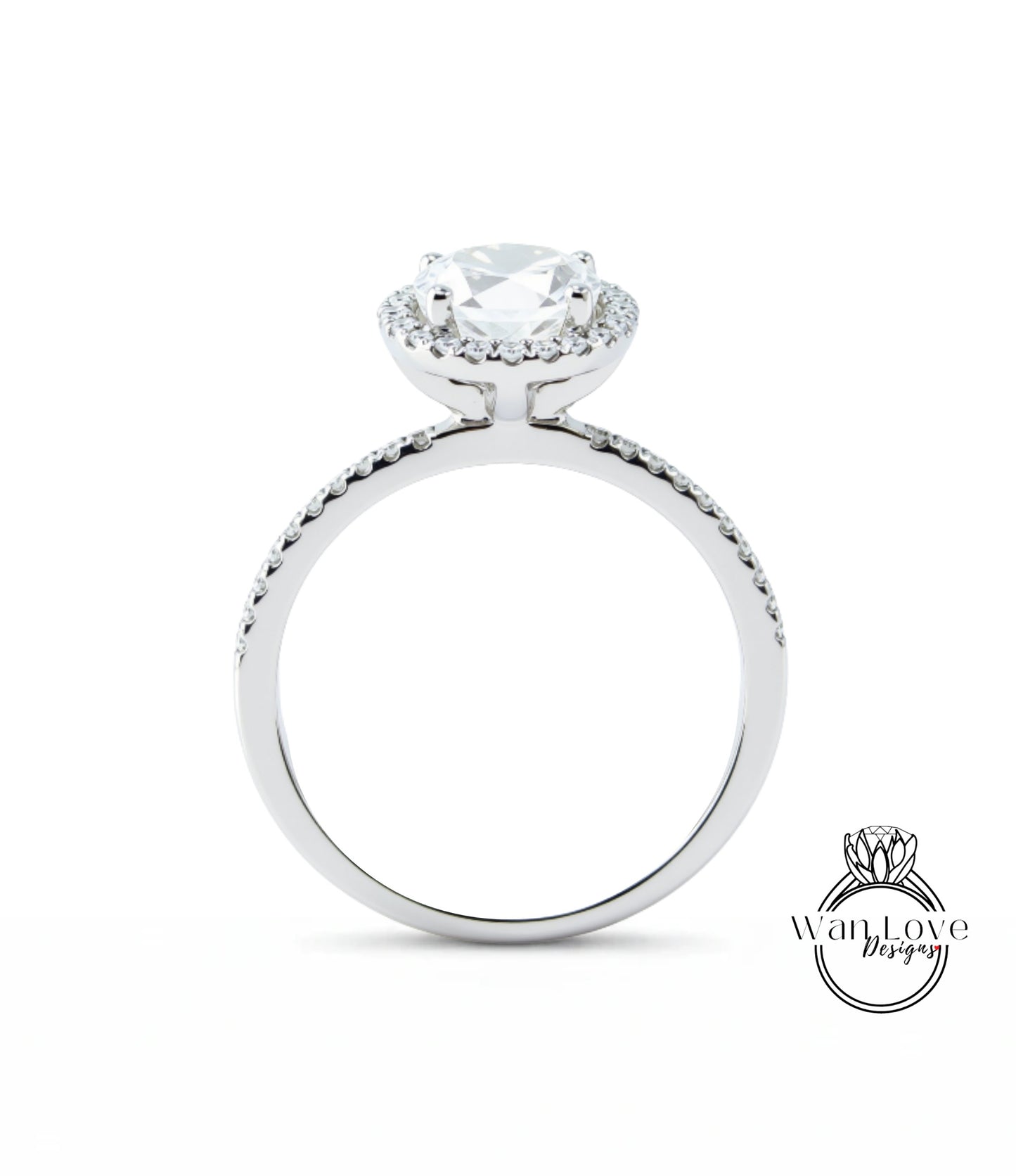 A silver engagement ring with a large central diamond surrounded by smaller diamonds, set in a halo of smaller diamonds.