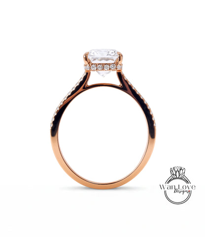 A close-up view of a gold ring with a large diamond center stone, showcasing the intricate design and craftsmanship of the jewelry piece.