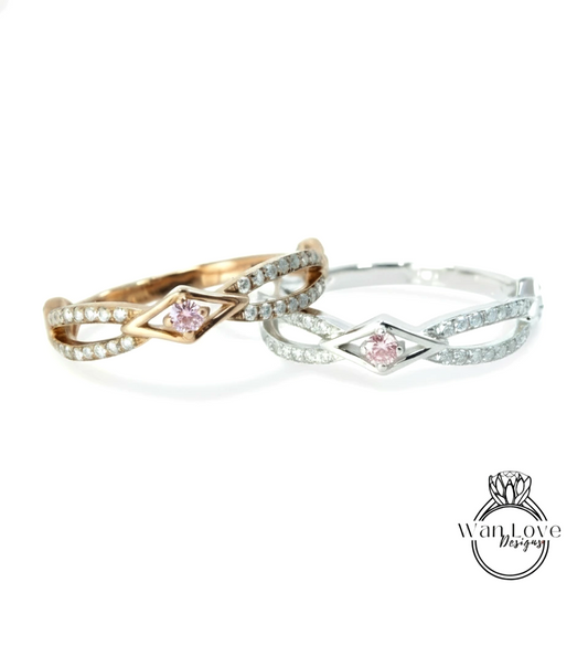 Two rings with pink gemstones are displayed against a white background.