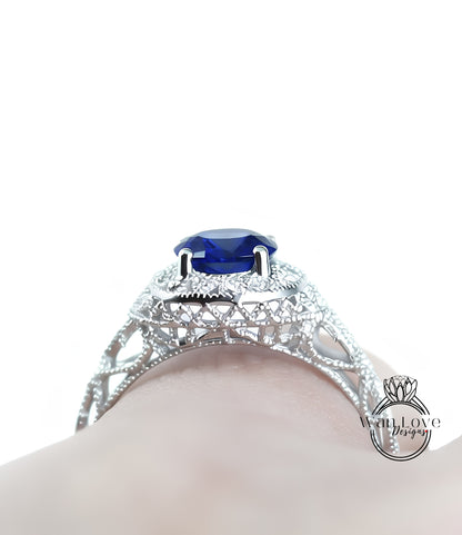 A close-up view of a silver ring with a large blue gemstone, showcasing the intricate design and craftsmanship.