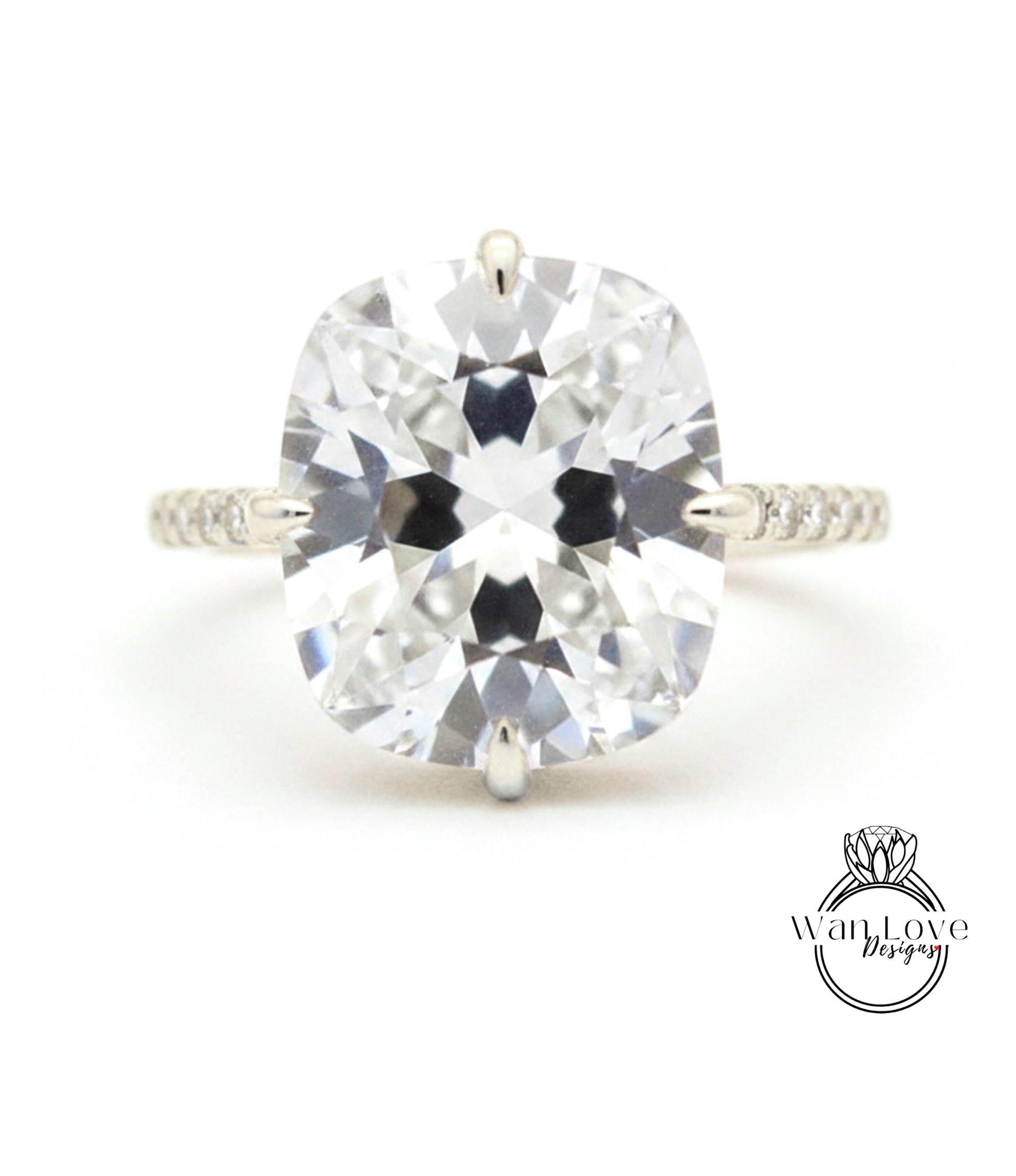 A large, clear diamond engagement ring with a prominent center stone.
