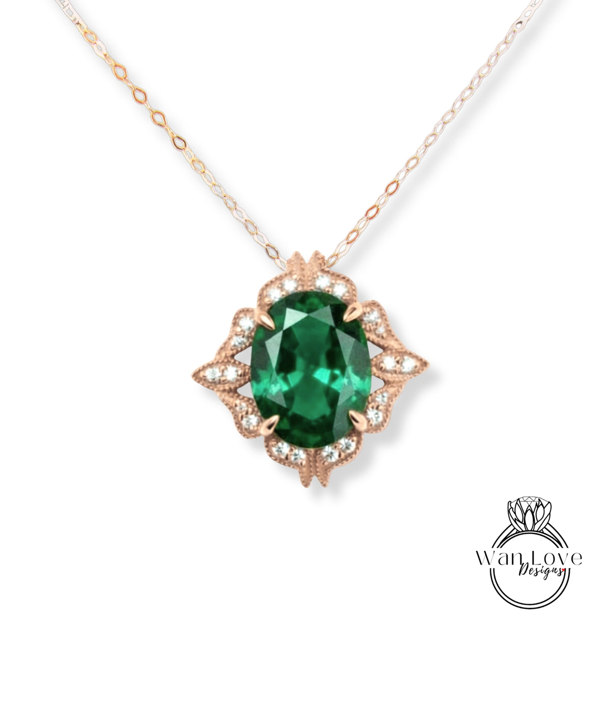 A necklace with a large oval-shaped green gemstone surrounded by a decorative floral design and small diamonds.