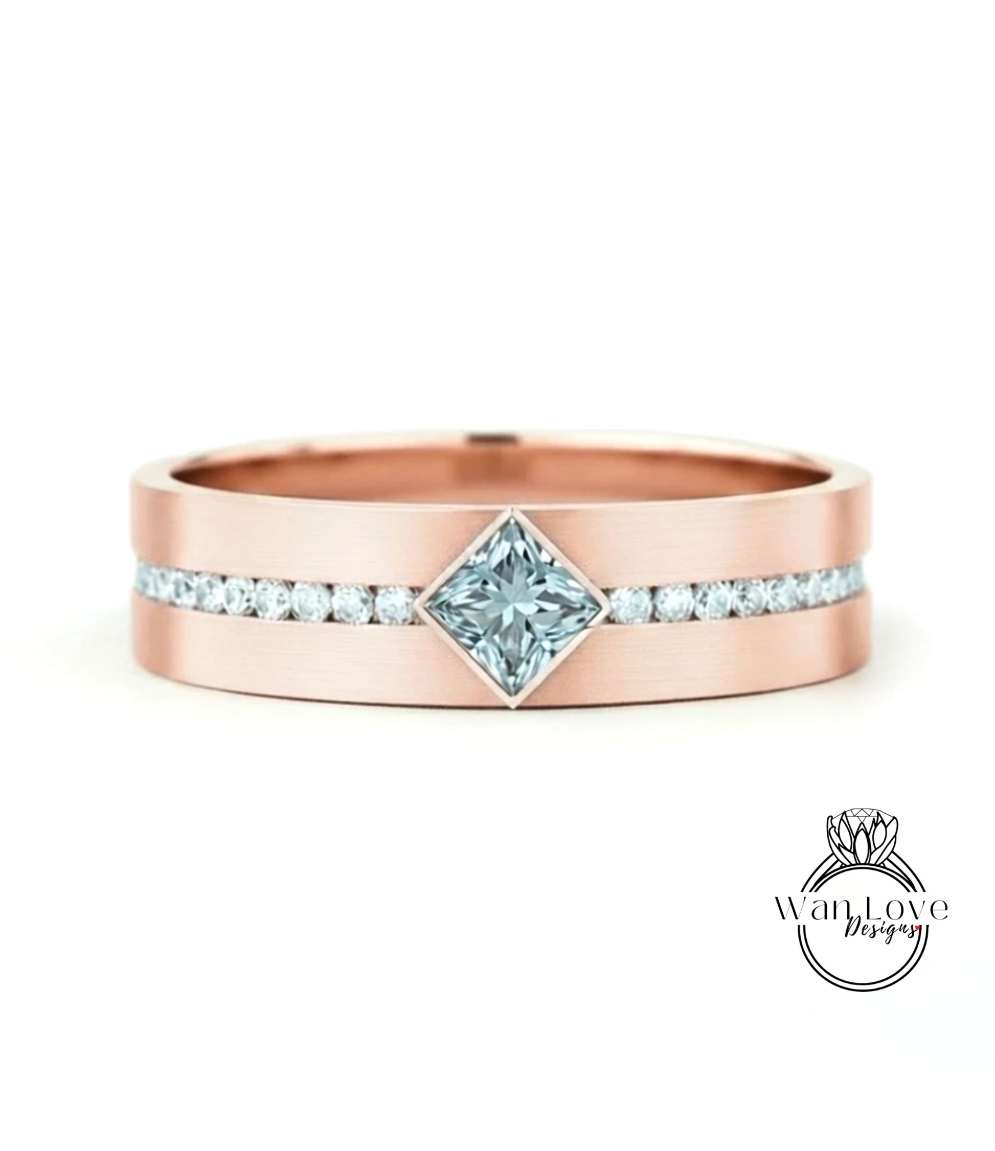 A rose gold ring with a large diamond set in the center, surrounded by smaller diamonds along the band.