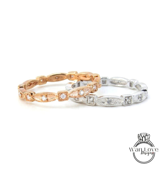 two rings, one in gold and one in silver, both adorned with small diamonds.