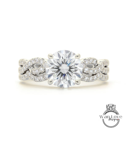 A close-up of a diamond engagement ring with a large central diamond surrounded by smaller diamonds set in a twisted metal band.