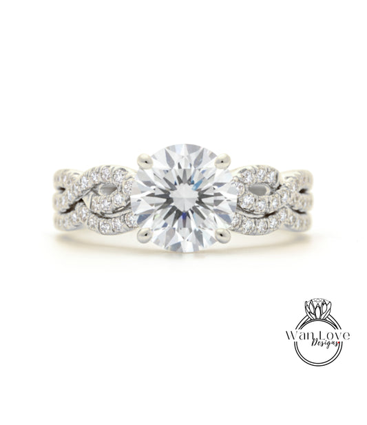 A close-up of a diamond engagement ring with a large central diamond surrounded by smaller diamonds set in a twisted metal band.