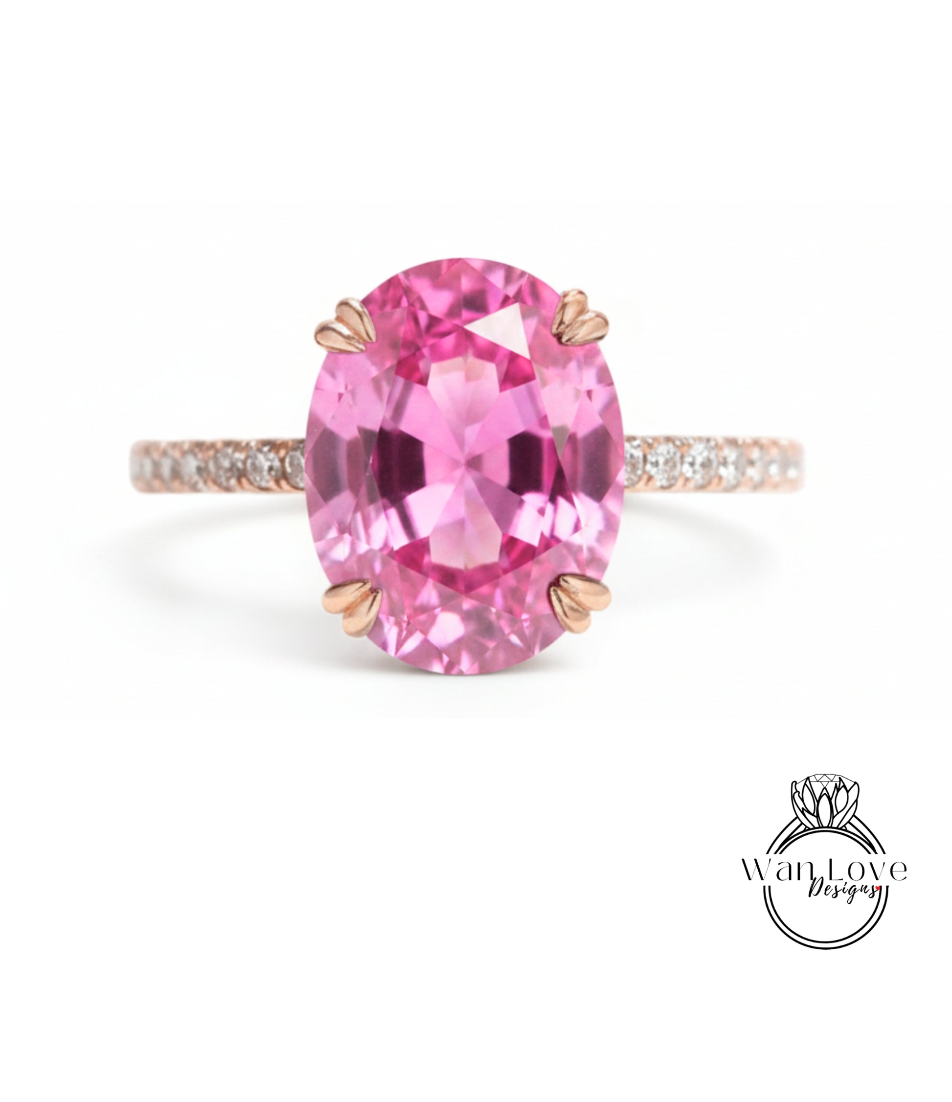 A pink gemstone ring with a large oval-shaped gemstone set in a rose gold band.