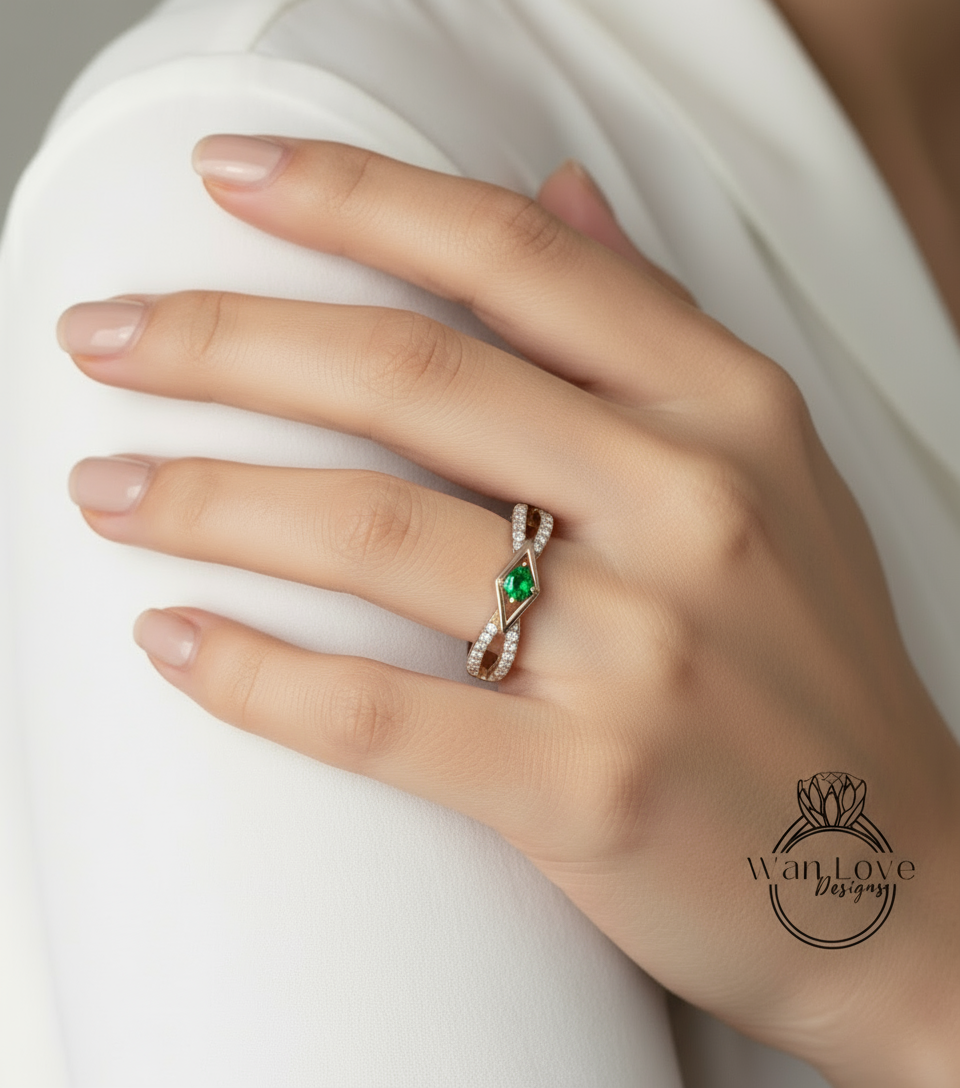 A close-up of a hand wearing a ring with a green gemstone.