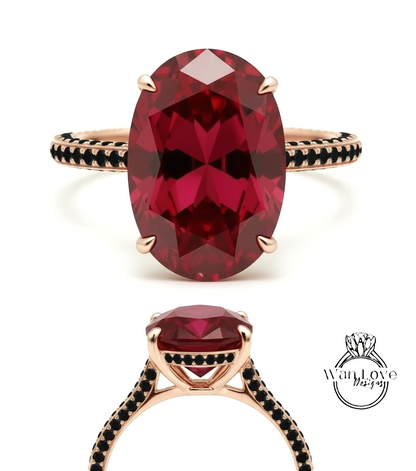 a large, oval-shaped red gemstone set in a gold ring with black accents.