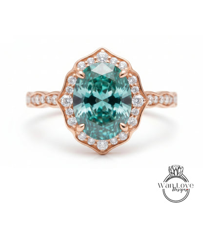 a beautiful ring with a large oval-shaped gemstone set in a rose gold band, surrounded by smaller diamonds.