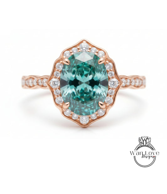 a beautiful ring with a large oval-shaped gemstone set in a rose gold band, surrounded by smaller diamonds.