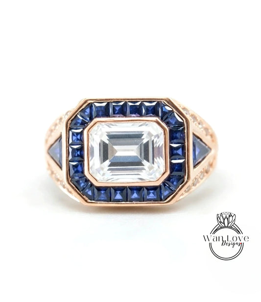 a gold ring with a large central gemstone surrounded by smaller blue gemstones.