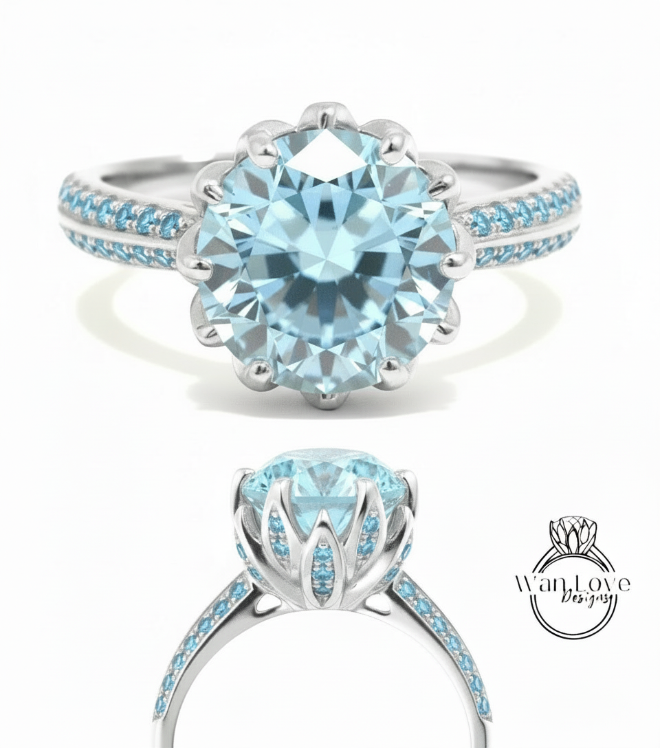A stunning blue diamond engagement ring with a large central diamond surrounded by smaller diamonds set in a silver band.