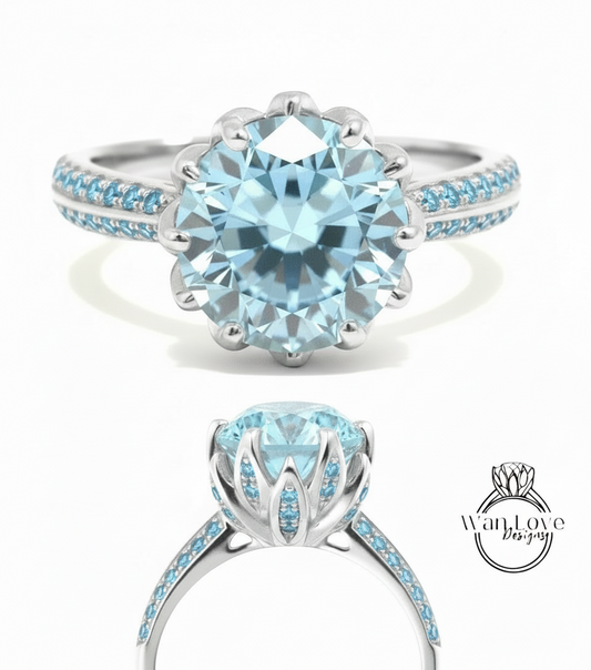 A stunning blue diamond engagement ring with a large central diamond surrounded by smaller diamonds set in a silver band.