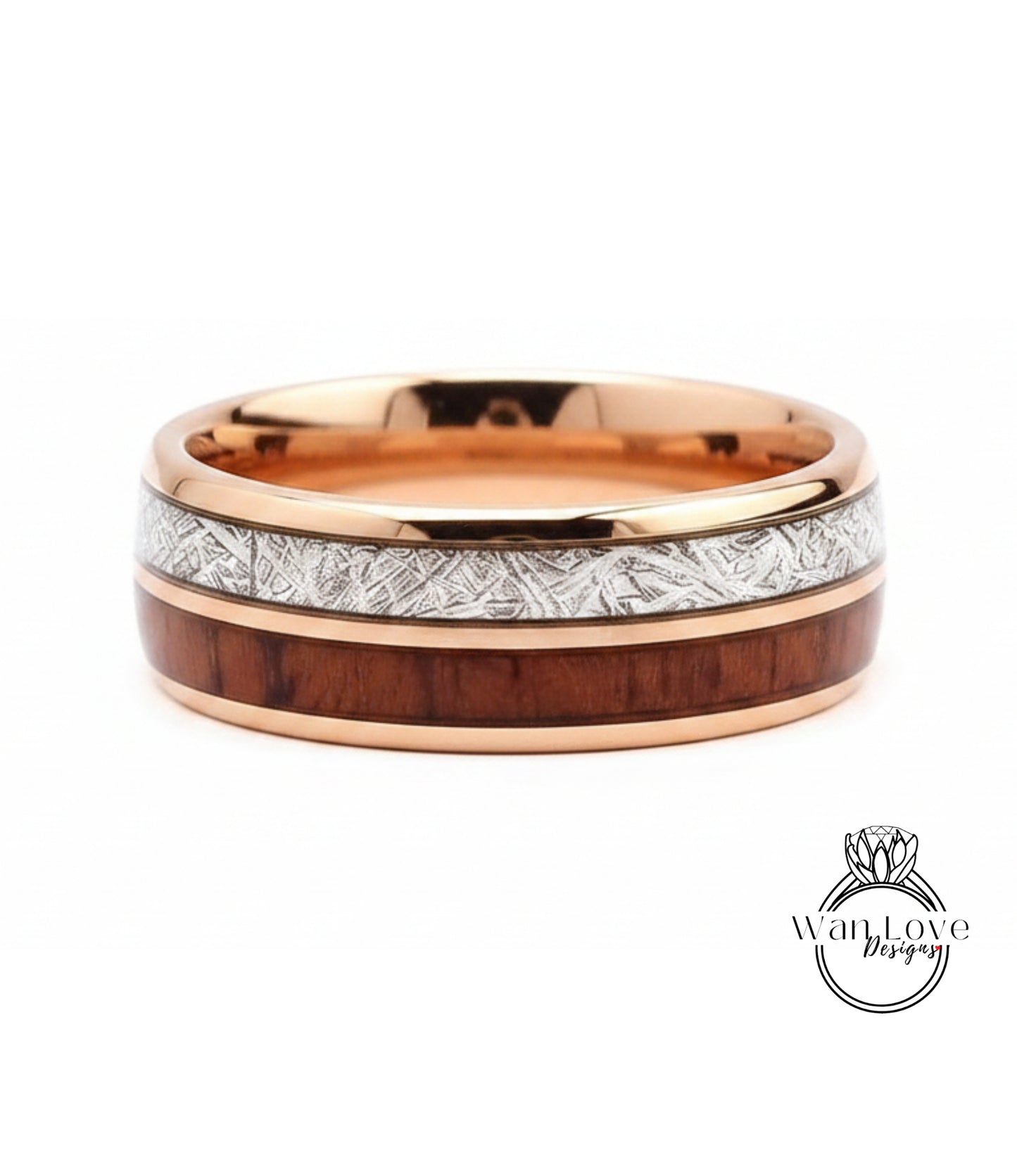 A gold-toned ring with a wooden band and a metallic band with a patterned design.