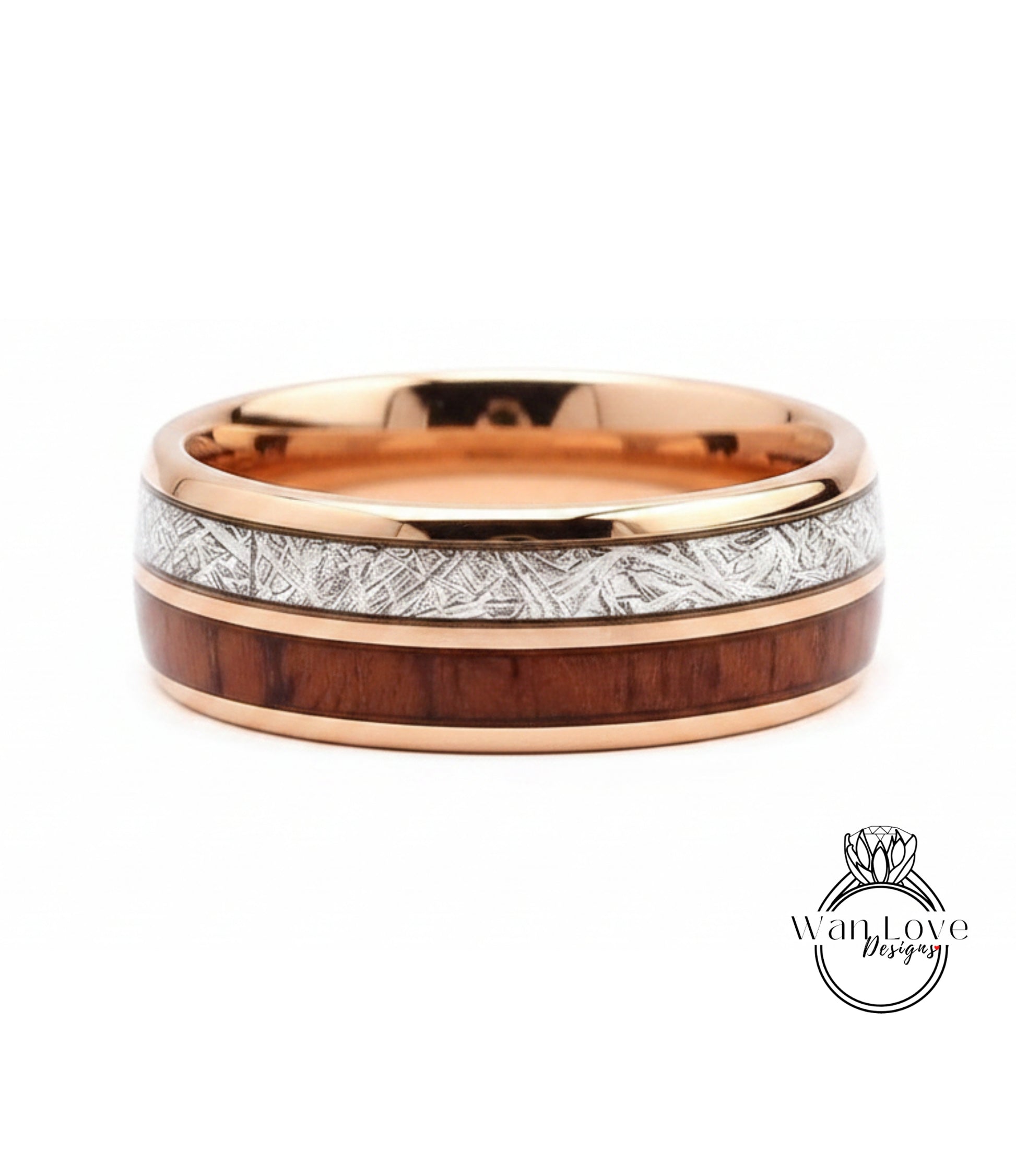 A gold-toned ring with a wooden band and a metallic band with a patterned design.